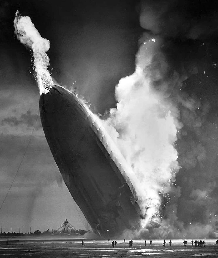 Burning airship disaster with enormous flames and smoke, a striking image that triggers fear in those with megalophobia.