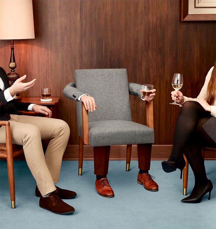 A surreal and humorous image showing a chair with human legs, arms, and hands, appearing as if it is casually participating in a conversation while holding a glass of water. The chair is positioned between two people who are engaged in a discussion, adding to the absurdity of the scene. This quirky setup could inspire a "funny group chat name" related to unexpected guests, strange encounters, or humorous office meetings. A surreal and humorous image showing a chair with human legs, arms, and hands, appearing as if it is casually participating in a conversation while holding a glass of water. The chair is positioned between two people who are engaged in a discussion, adding to the absurdity of the scene. This quirky setup could inspire a "funny group chat name" related to unexpected guests, strange encounters, or humorous office meetings.