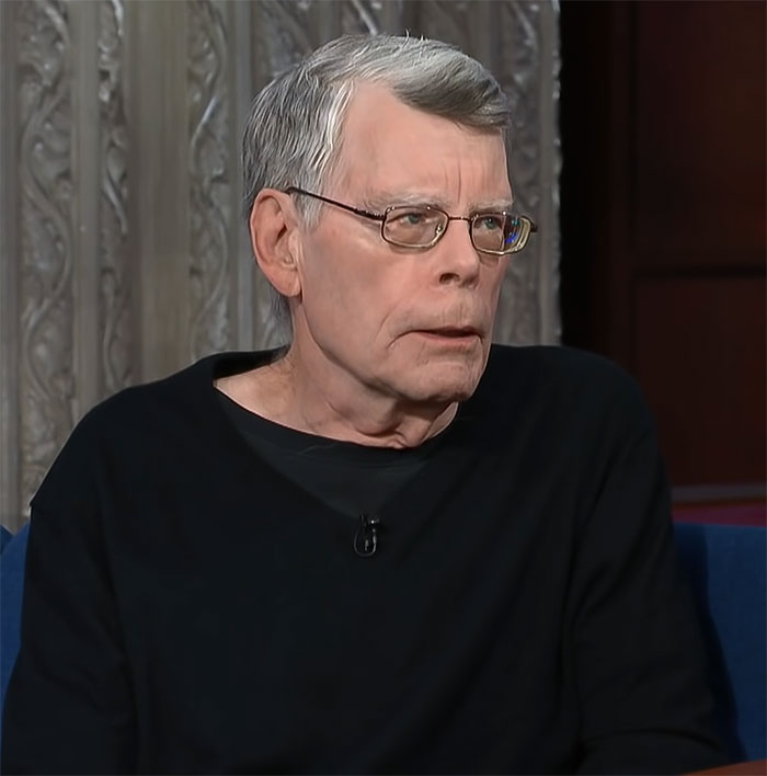Stephen King sitting during an interview, wearing glasses and a black sweater. Stephen King sitting during an interview, wearing glasses and a black sweater.