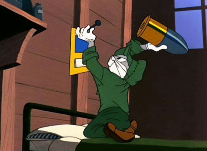 Bugs Bunny, dressed in green, prepares to load a large shell into a weapon inside a wooden cabin, signaling action. The scene conveys focus and determination. Bugs Bunny, dressed in green, prepares to load a large shell into a weapon inside a wooden cabin, signaling action. The scene conveys focus and determination.