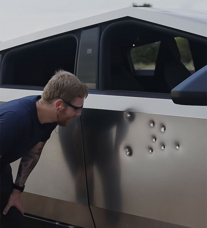 Man Fires Bullets Into His Cybertruck To Test If Elon Musk's Bulletproof Claims Are Real Man Fires Bullets Into His Cybertruck To Test If Elon Musk's Bulletproof Claims Are Real