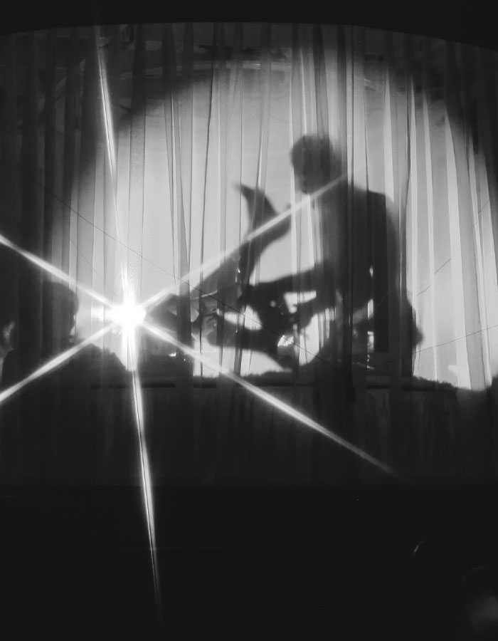 Shadow of person behind curtains, dramatic stage scene, evokes strong reactions. Shadow of person behind curtains, dramatic stage scene, evokes strong reactions.