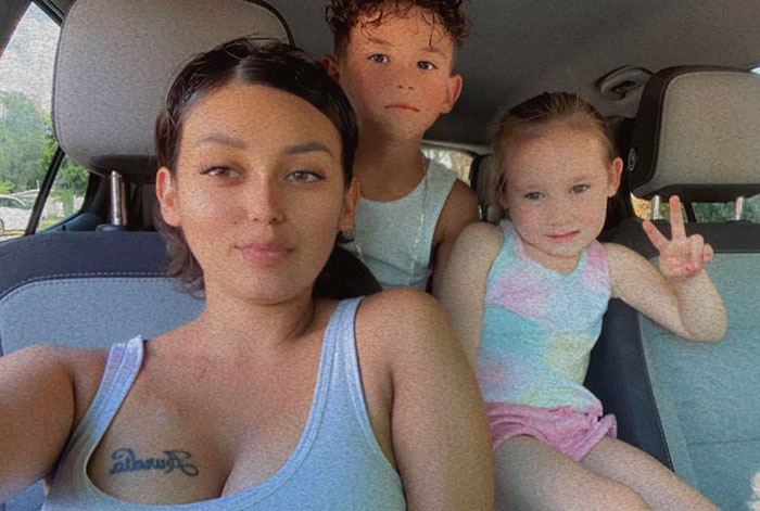 Single mom with two kids in a car, showcasing community support after terminal diagnosis. Single mom with two kids in a car, showcasing community support after terminal diagnosis.