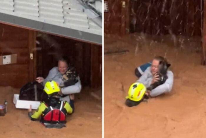 Brave Woman Holds On To Her Dog In Neck-Deep Floodwater As They Wait For Rescue Helicopter Brave Woman Holds On To Her Dog In Neck-Deep Floodwater As They Wait For Rescue Helicopter