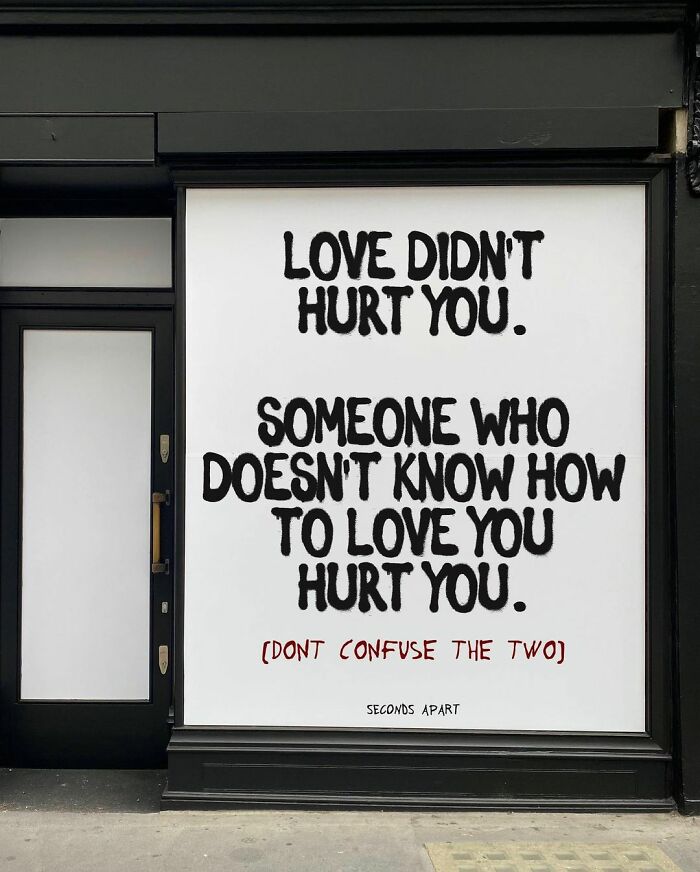 Street art in London displaying a wholesome message about love and hurt, conveying heartfelt advice to passersby.