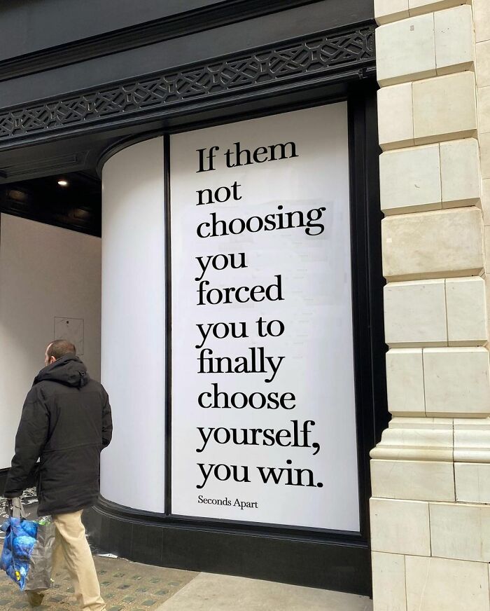 Wholesome message on a London street wall about choosing yourself and winning, inspiring hope and self-worth.