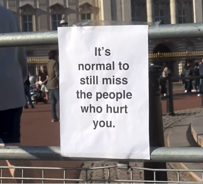 Wholesome message on a street sign in London saying it’s normal to miss people who hurt you, touching hearts.