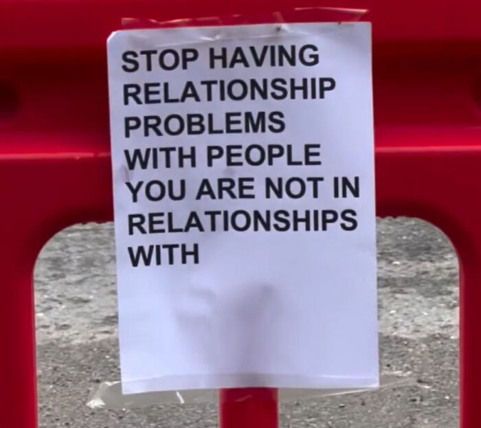 A wholesome street message in London advising to stop having relationship problems with people you're not connected to.