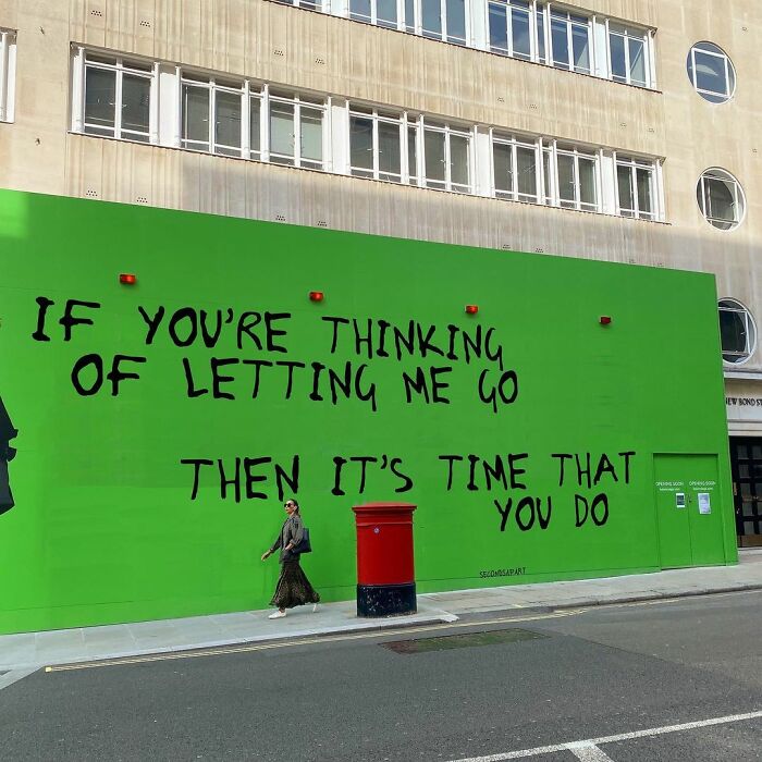 Green street art in London with a heartfelt message about letting go, capturing wholesome messages from the streets of London.