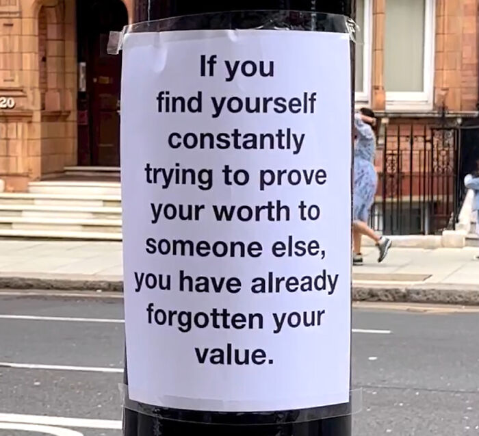 Wholesome message on a London street reminding people not to forget their value while proving worth to others.