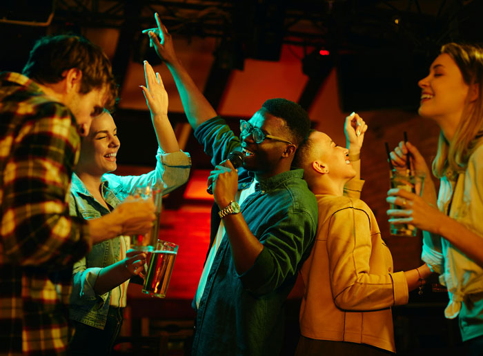 Young adults enjoying a lively night out, highlighting family friend drama and personal choices. Young adults enjoying a lively night out, highlighting family friend drama and personal choices.