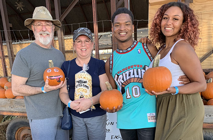 Group of friends celebrating with pumpkins, highlighting viral strangers-turned-friends enjoying their Thanksgiving together. Group of friends celebrating with pumpkins, highlighting viral strangers-turned-friends enjoying their Thanksgiving together.