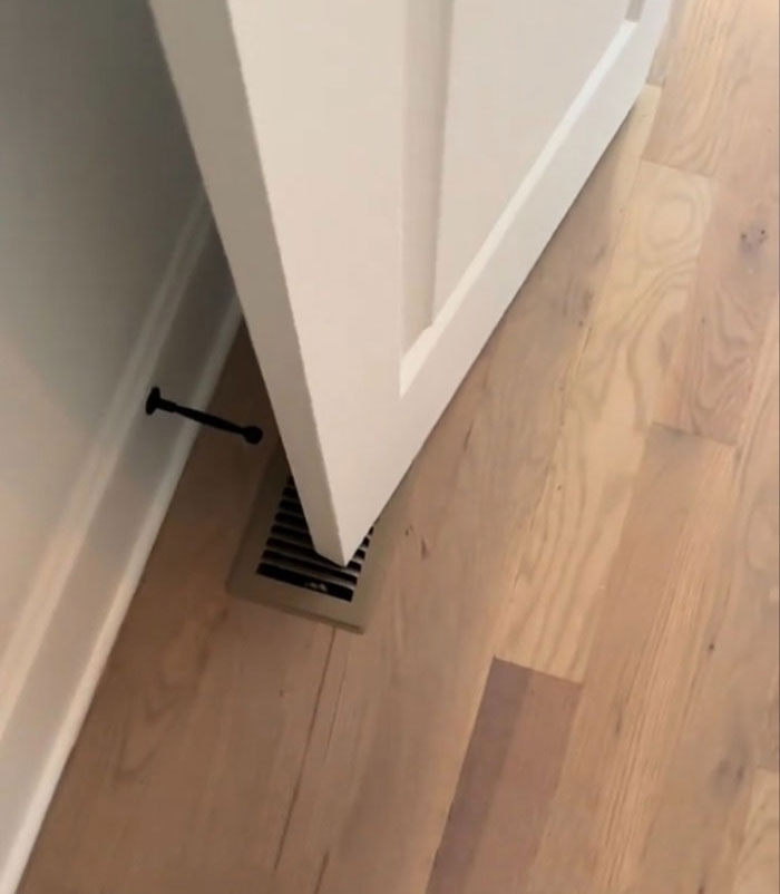 White door in $1,600,000 home built 2 years ago showing flawed construction with misaligned placement over floor vent. White door in $1,600,000 home built 2 years ago showing flawed construction with misaligned placement over floor vent.