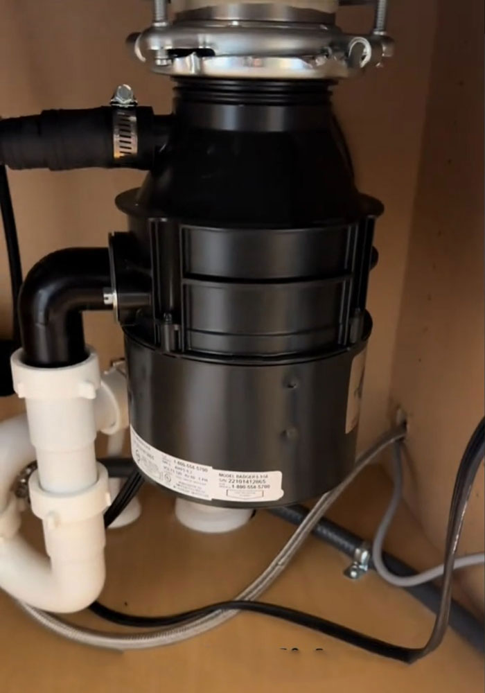 Garbage disposal unit under the sink, part of a $1,600,000 home's surprising condition. Garbage disposal unit under the sink, part of a $1,600,000 home's surprising condition.