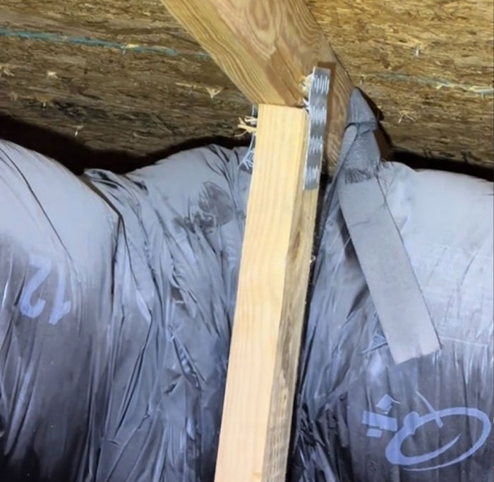 Poor condition of insulation and beam in $1,600,000 home built 2 years ago, highlighting inspection findings. Poor condition of insulation and beam in $1,600,000 home built 2 years ago, highlighting inspection findings.