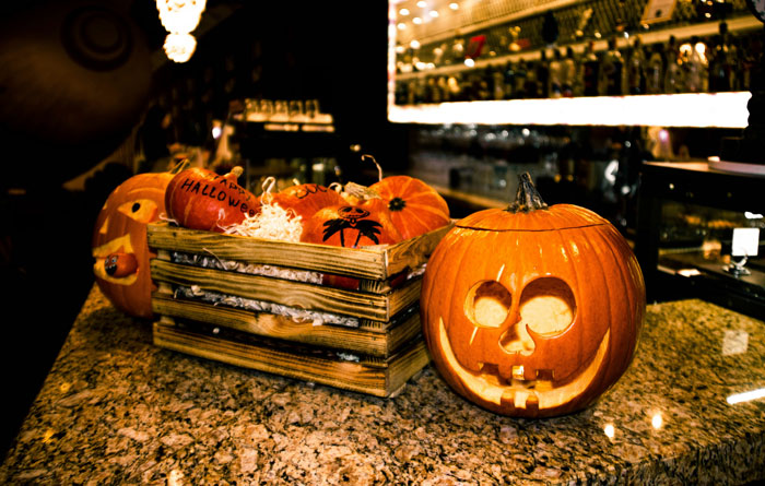 Halloween pumpkins on a kitchen counter, supporting son's interest with family drama theme. Halloween pumpkins on a kitchen counter, supporting son's interest with family drama theme.