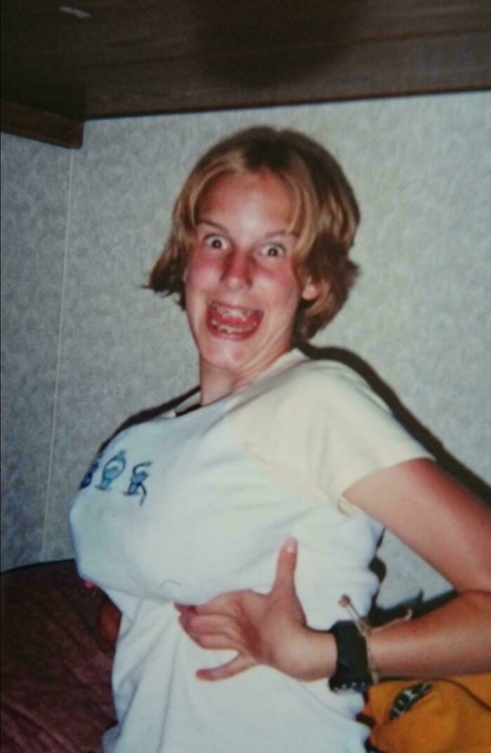 Youthful person making funny face, showcasing an awkward blunder year moment.