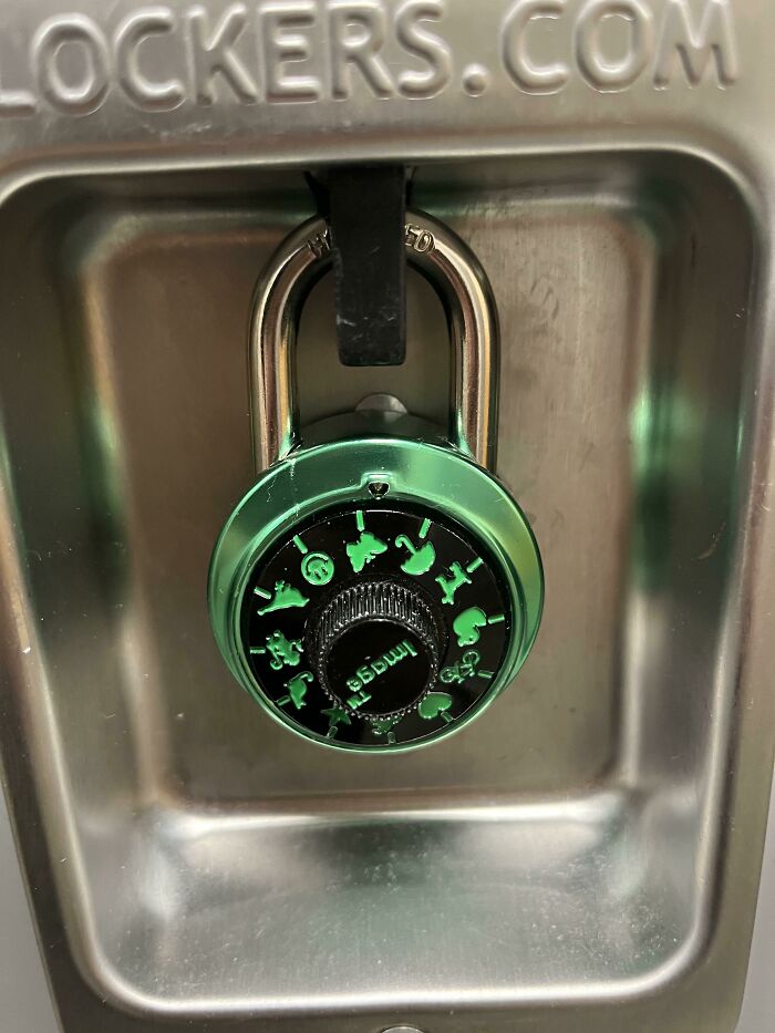 A creatively designed green combination lock features animal icons instead of numbers, showcasing excellent design.
