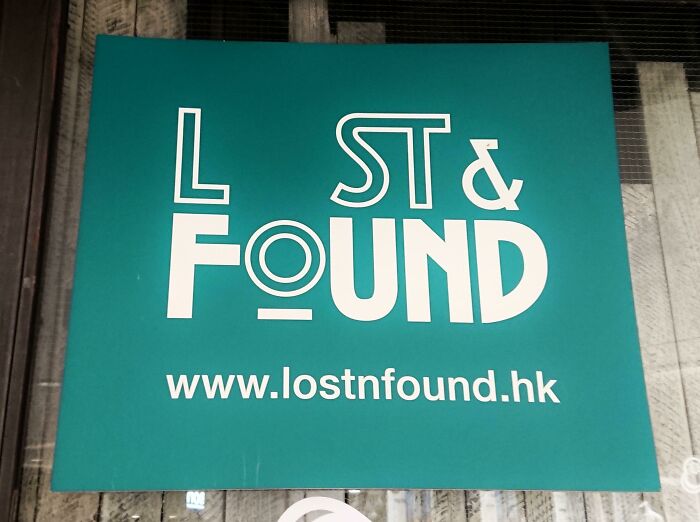 Lost and found sign with creative typography on a teal background, featuring the website URL: www.lostnfound.hk.