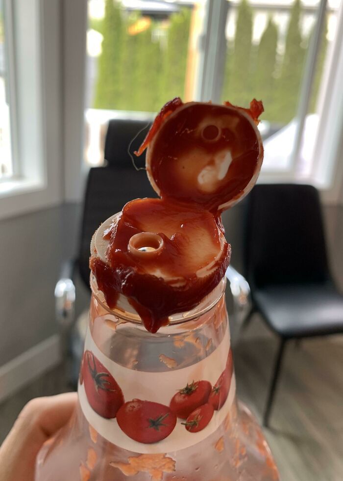 Ketchup bottle with a messy lid, resembling common infuriating family habits in the kitchen.