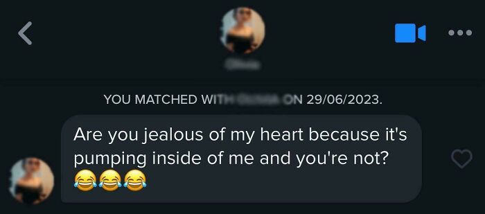 Humorous Tinder post with a playful message about jealousy, featuring emojis.