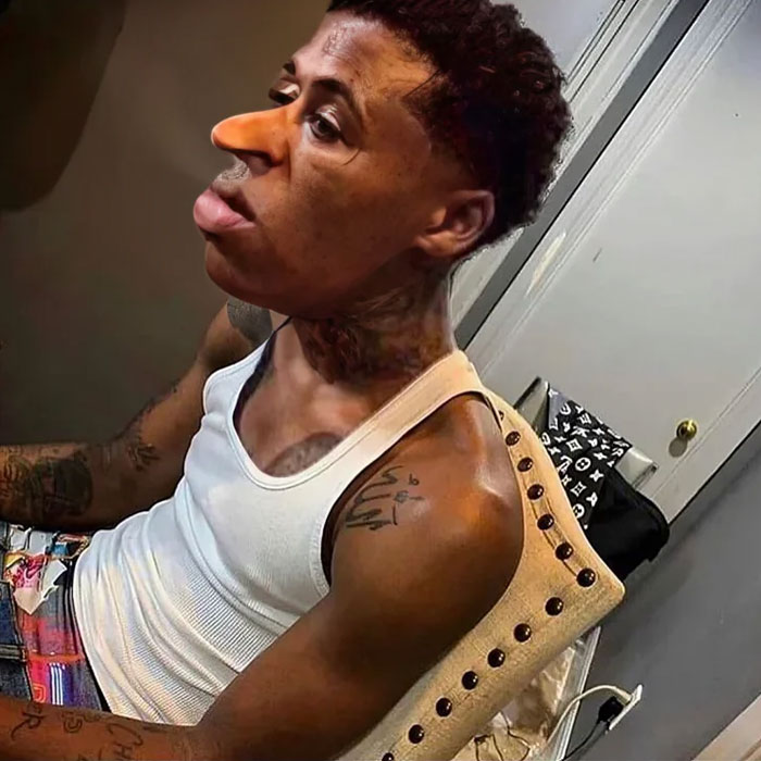 Quandale Dingle meme featuring an exaggerated facial edit on a seated person, adding a humorous twist to the image. Quandale Dingle meme featuring an exaggerated facial edit on a seated person, adding a humorous twist to the image.