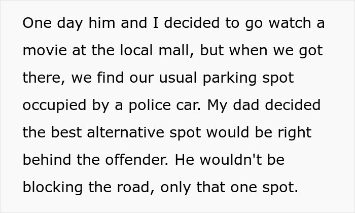 Text describing a police car parked in a handicapped spot at a local mall. Text describing a police car parked in a handicapped spot at a local mall.