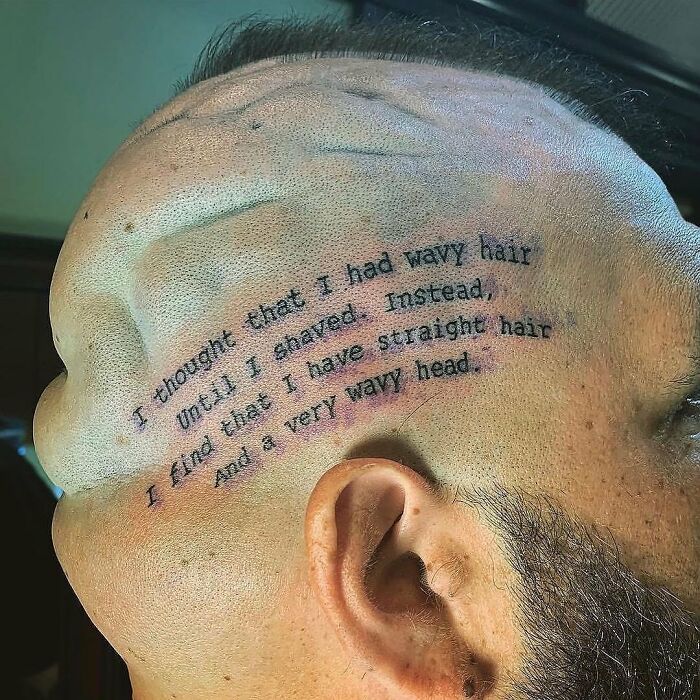 A humorous tattoo fail on a person's head with wavy text reflecting the head's shape. A humorous tattoo fail on a person's head with wavy text reflecting the head's shape.
