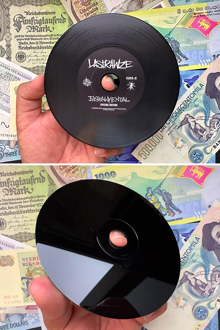 Creative vinyl-style CD design on colorful currency background.