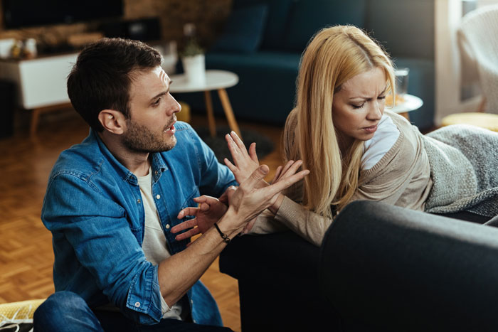 Man and woman in a heated discussion about family heirlooms, woman appears hesitant. Man and woman in a heated discussion about family heirlooms, woman appears hesitant.