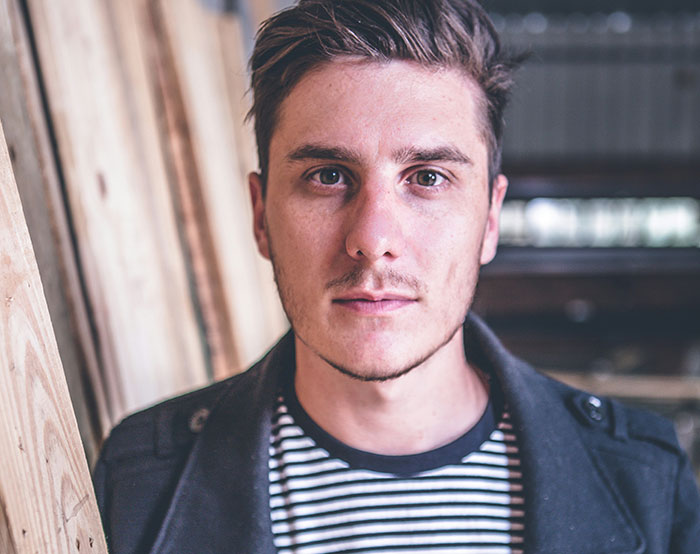 A man in a striped shirt standing indoors, linked to a story about a woman running away from a date. A man in a striped shirt standing indoors, linked to a story about a woman running away from a date.