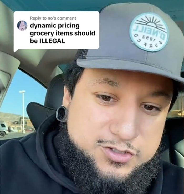 Man discusses dynamic pricing in retail, questioning legality, wearing a cap in a car setting. Man discusses dynamic pricing in retail, questioning legality, wearing a cap in a car setting.