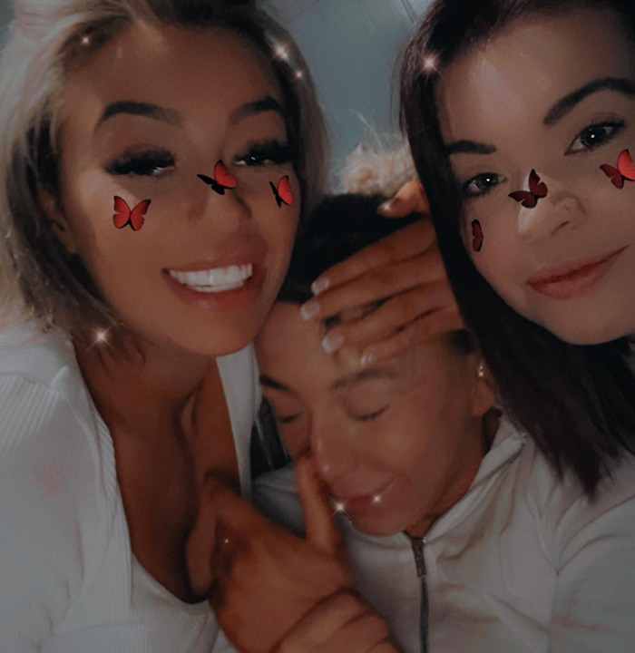 Demi Agoglia smiling with her relatives. Demi Agoglia smiling with her relatives.