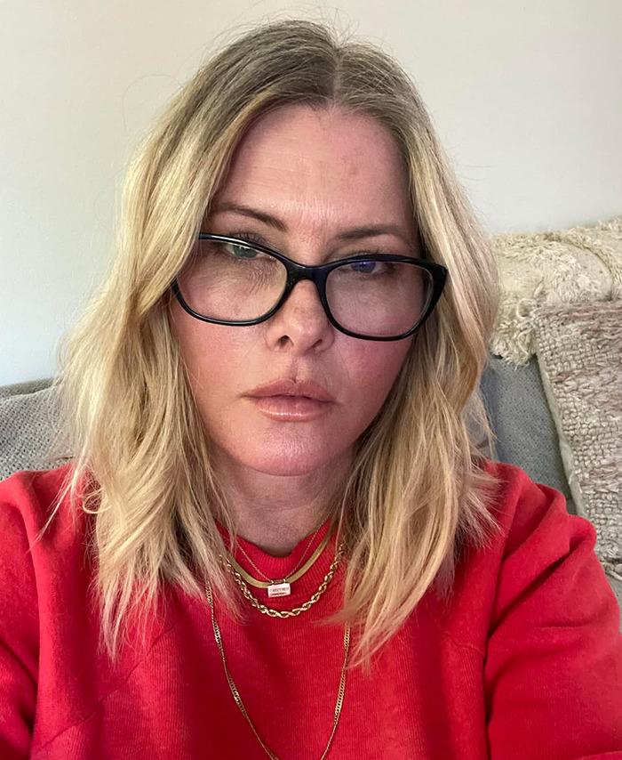 "Baywatch" icon Nicole Eggert wearing glasses and a red top. "Baywatch" icon Nicole Eggert wearing glasses and a red top.