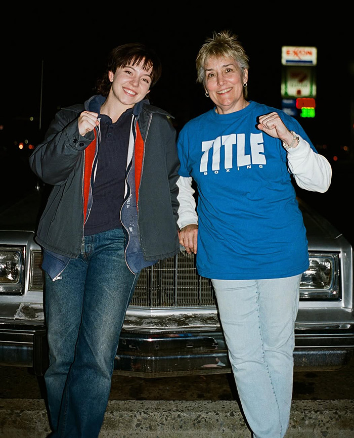 Sydney Sweeney and Christy Martin standing in front of a car at night, both smiling and relaxed. Sydney Sweeney and Christy Martin standing in front of a car at night, both smiling and relaxed.
