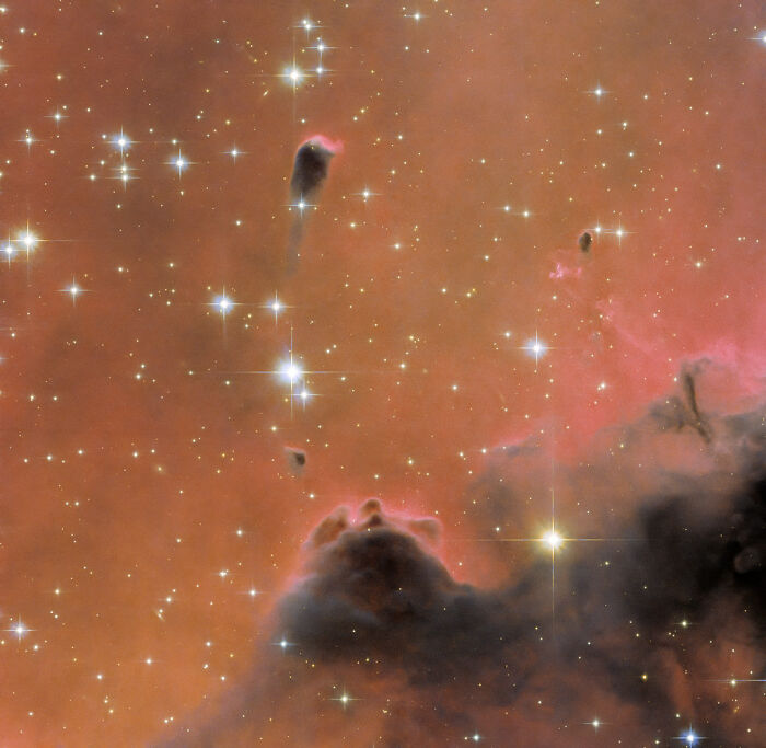 Colorful nebula with bright stars and cosmic dust formations, showcasing the beauty of space.