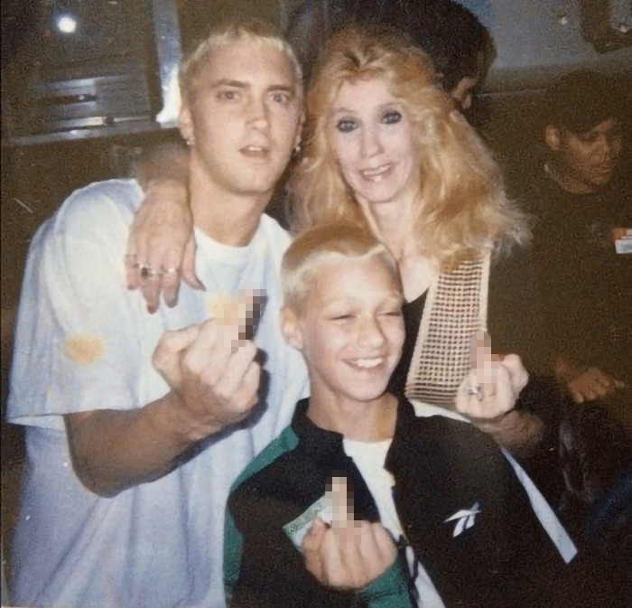 Three people in a candid moment, capturing a sense of emotion and family connection. Three people in a candid moment, capturing a sense of emotion and family connection.