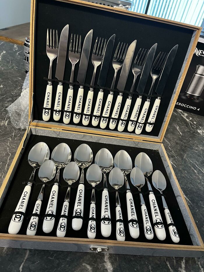 Elegant Chanel cutlery set in a wooden box, showcasing stylish design fromą amazing mothers-in-law.