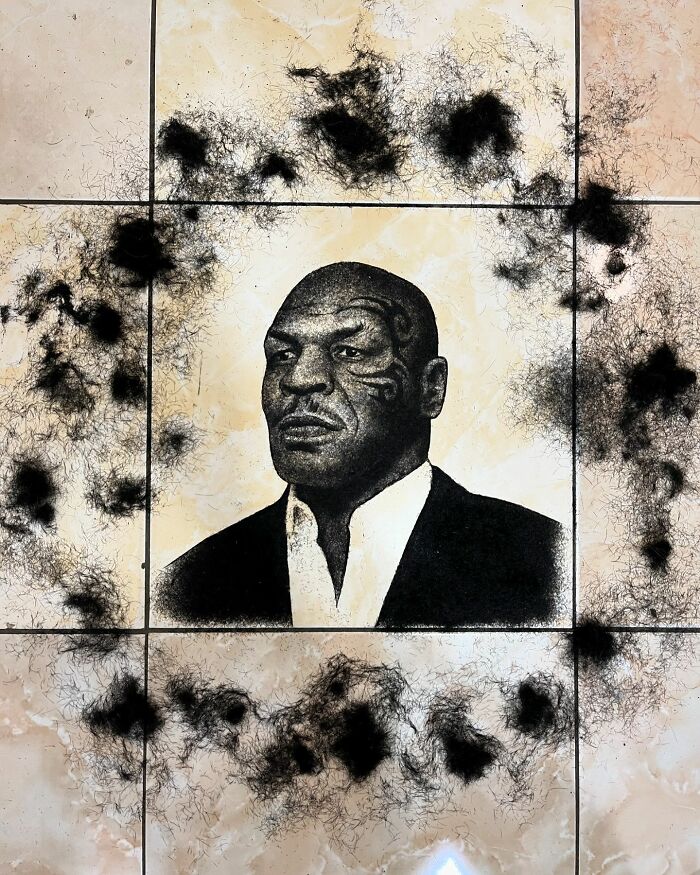 Creative barber portrait made with cut hair features a detailed image on a tiled floor.