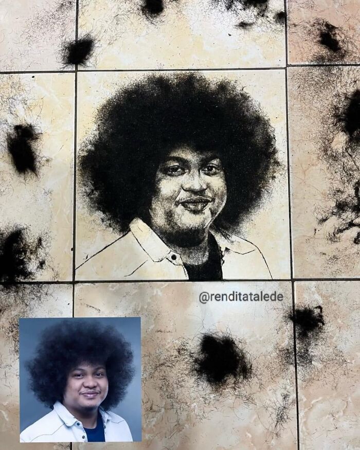 Creative barber portrait using cut hair on a tiled floor, featuring a person in a white shirt with an afro hairstyle.
