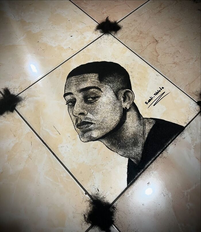 Creative portrait of a man made from cut hair on a tiled floor, showcasing a unique barber art style.