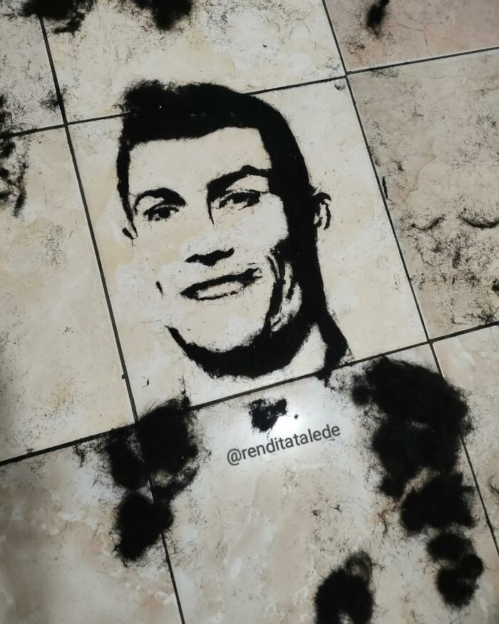 Creative portrait made of cut hair on a tile floor by a barber, featuring a realistic likeness.