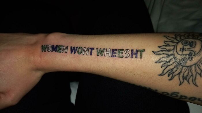 Tattoo fail with "Women Wont Wheesht" text on forearm, next to a sun design.