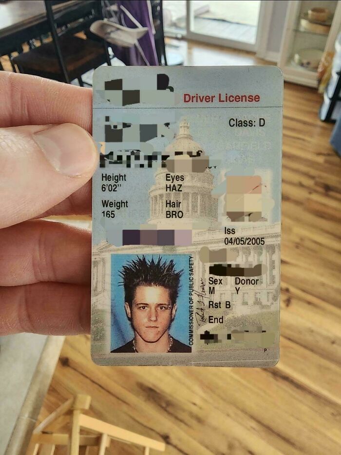 Driver's license photo with spiked hair, capturing an embarrassing blunder from past years.