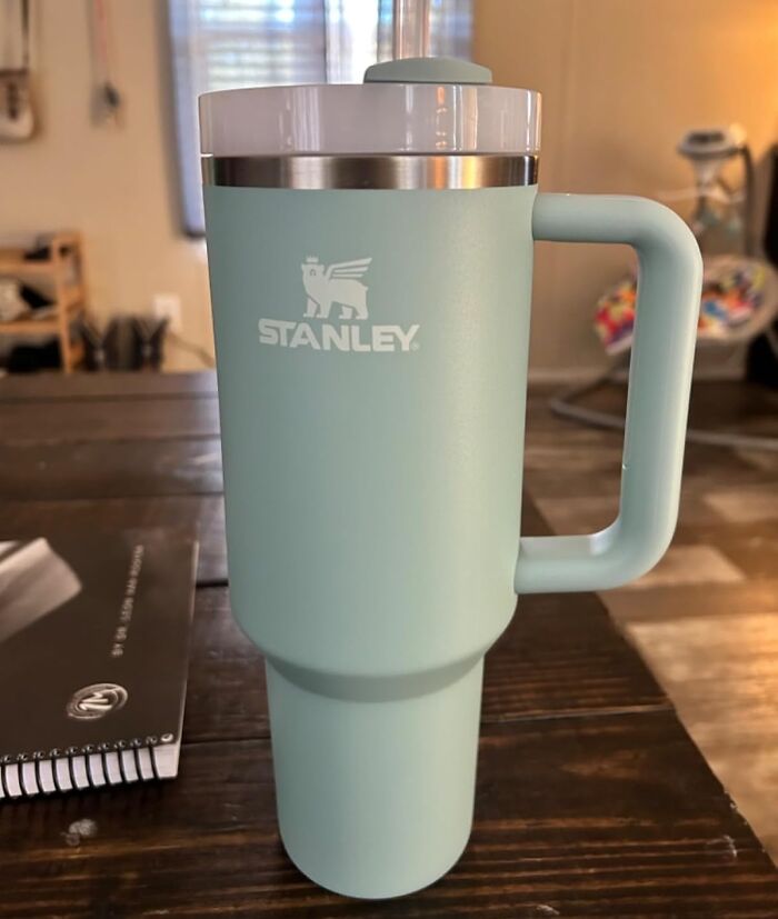 Mint Stanley mug on a table, a thoughtful gift for teachers.