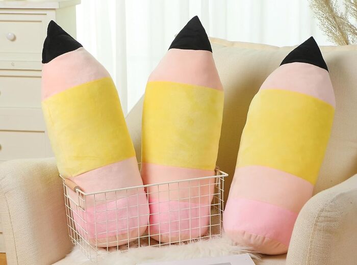 Plush pencil pillows in a cozy setting, ideal gifts for teachers.