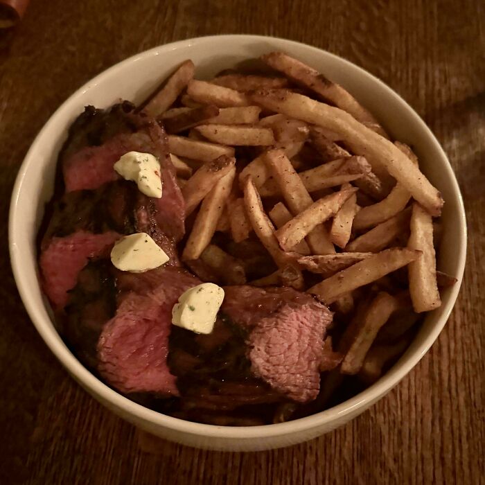 Steak and fries served together in a bowl, showcasing one of the most ridiculous ways people had their food served in restaurants.