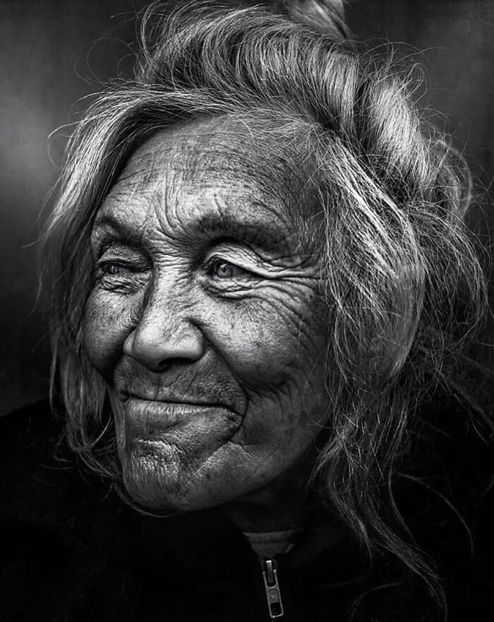 A soulful black and white portrait of an elderly woman captured by Lee Jeffries.