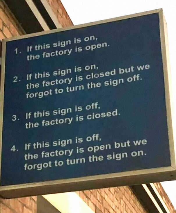 Weird and absurd sign with mixed instructions about factory status, highlighting humorous confusion.