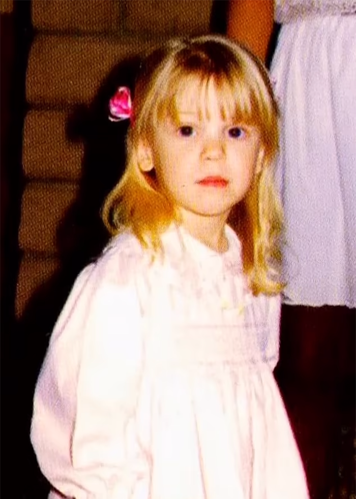 Young Jenna Miscavige with a pink bow looks into the camera, related to ex-Scientologist's claims of brainwashing. Young Jenna Miscavige with a pink bow looks into the camera, related to ex-Scientologist's claims of brainwashing.